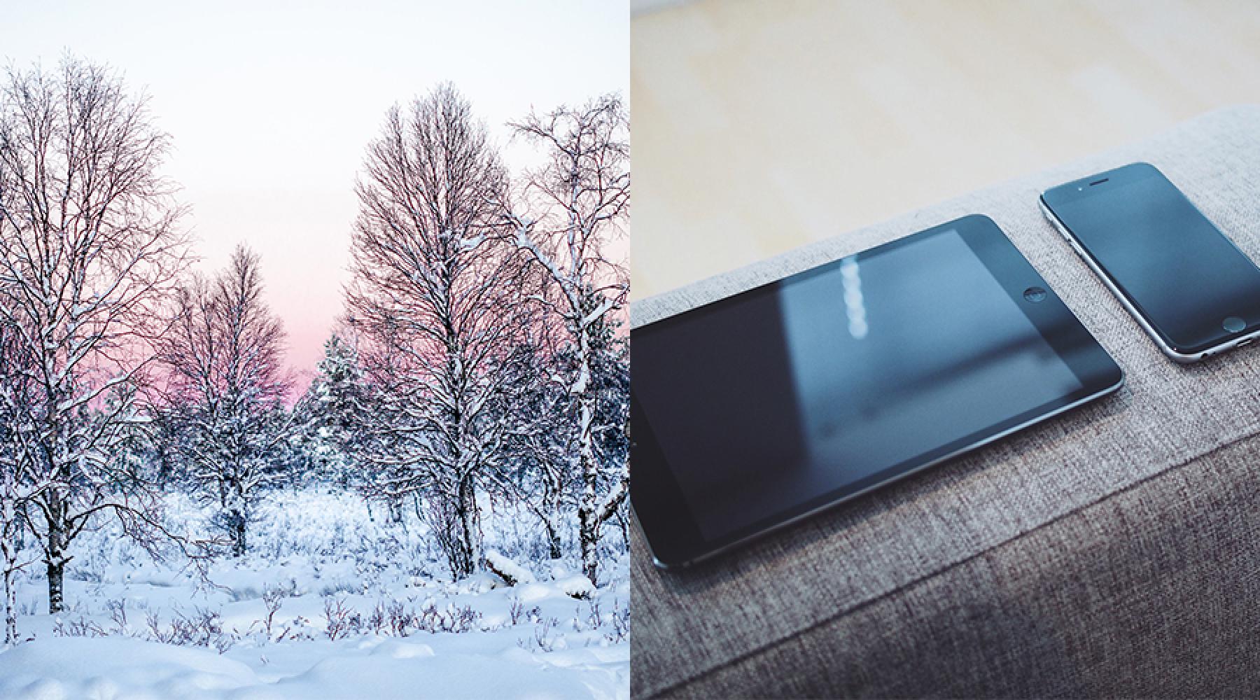 Bild på vinterlandskap och smartphone / surfplatta